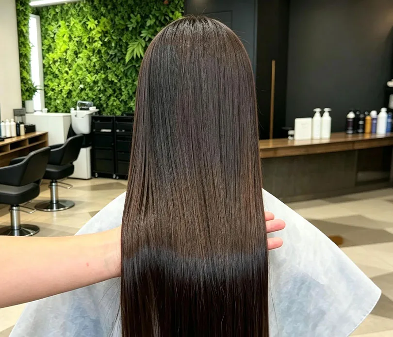 Loose C-curl waves through long hair, seen from behind