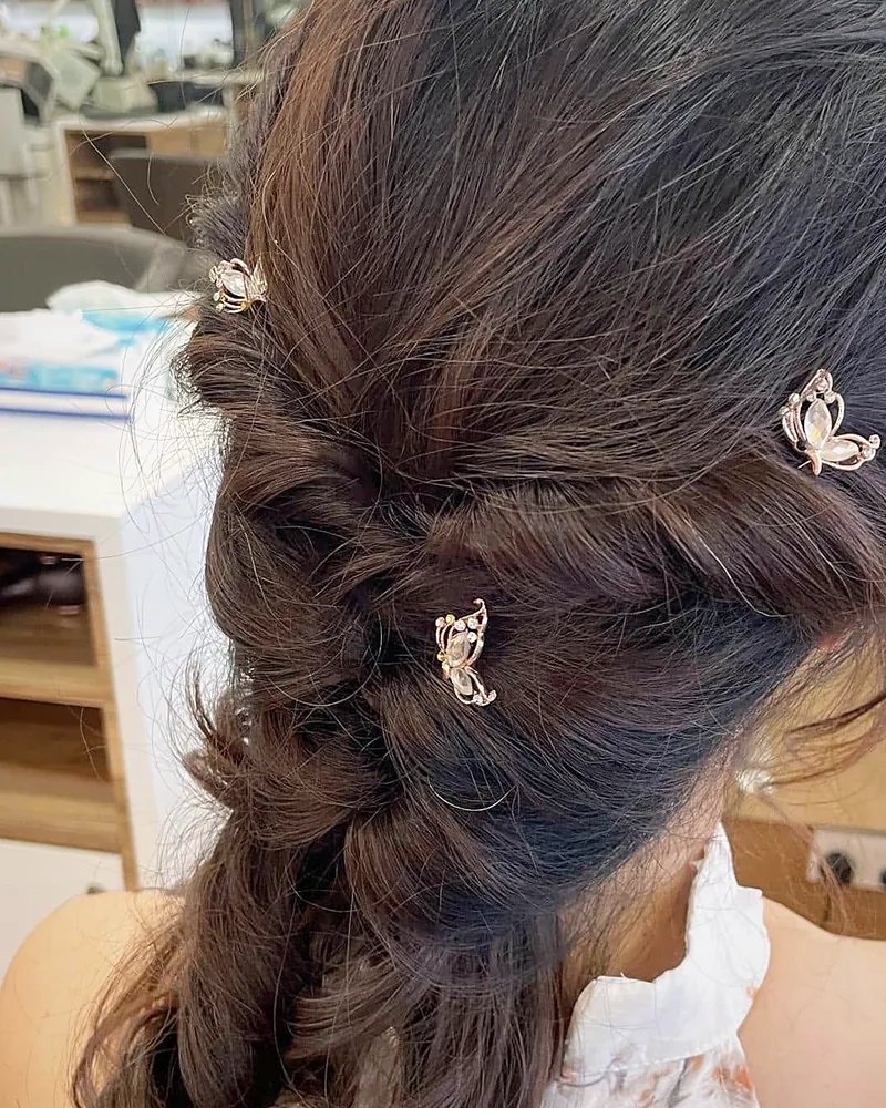 A braided half-up set with pearl clips